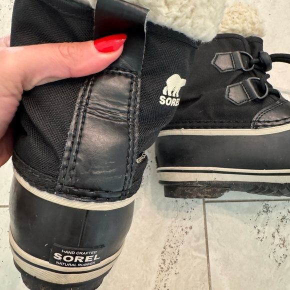 Sorel Kids’ Yoot Pac Waterproof Snow Boot Black and Faux-Shearling - Picture 2 of 9